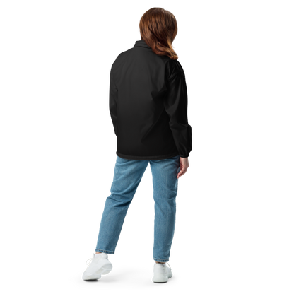 Persona de pie de espaldas usando Cortavientos Negro Unisex VOOM — The Motion Code con diseño impermeable y corte relajado.