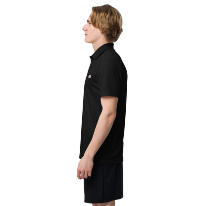 Perfil lateral de persona usando Polo Negro VOOM x adidas — The Discipline Code con corte deportivo y ajuste regular.