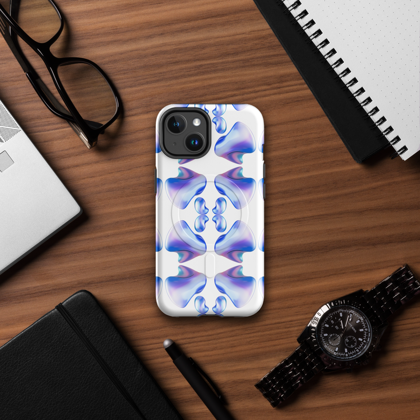 Funda MagSafe® VOOM para iPhone — The Flow Pattern Case con diseño abstracto en tonos azul y blanco sobre escritorio de madera