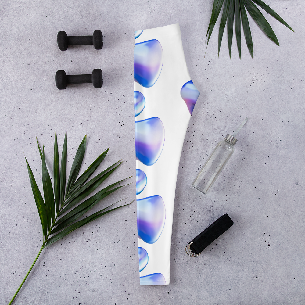 Leggings VOOM — The Flow Form sobre superficie gris con detalles azules y lilas junto a pesas y accesorios deportivos